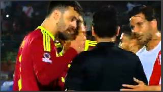 Fernando Amorebieta (Venezuela) is shown the red card for fighting.