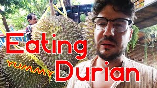 Eating durian for the first time. Smells like feet and garlic.