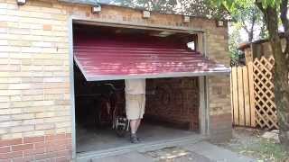 Подьёмные ворота из уголка и профнастила.Lifting gates from metal and corrugated sections